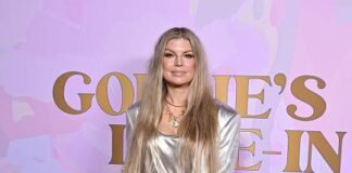 The songwriter Fergie wore a GENNY full look and handbag while attending The Goldie Hawn Foundation Celebrates 20th Anniversary Of MindUP Gala, held at Ron Burkle’s Green Acres in Beverly Hills.